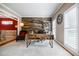 Stylish home office features a wood accent wall, white shutters, and modern decor for a productive workspace at 3620 Chartwell Dr, Suwanee, GA 30024
