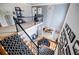 Elegant staircase showcasing a decorative railing, wood steps, and a stunning chandelier, leading to the upper level at 3620 Chartwell Dr, Suwanee, GA 30024
