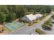 Aerial view showing community buildings, pickleball courts, parking area, and green spaces at 4115 Gold Mill Rdg, Canton, GA 30114