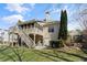 Lovely backyard featuring a spacious deck, mature trees, and a lush green lawn at 4115 Gold Mill Rdg, Canton, GA 30114