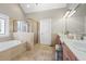 Spacious primary bathroom with double vanity, soaking tub and glass enclosed shower at 4115 Gold Mill Rdg, Canton, GA 30114