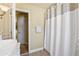 Neutral bathroom with white shower curtain, a stylish sink, and a calming atmosphere at 4115 Gold Mill Rdg, Canton, GA 30114