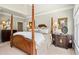 Well-appointed bedroom featuring dark wood furniture and tray ceiling at 4115 Gold Mill Rdg, Canton, GA 30114