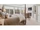 Spacious bedroom with fireplace, tv and large windows overlooking nature at 4115 Gold Mill Rdg, Canton, GA 30114
