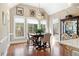 Breakfast nook with hardwood floors, modern light fixture, and many windows at 4115 Gold Mill Rdg, Canton, GA 30114