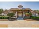 Elegant clubhouse featuring stone accents, a welcoming entrance, and beautiful landscaping at 4115 Gold Mill Rdg, Canton, GA 30114