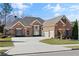 Charming brick home with manicured lawn, two-car garage, and ample driveway space at 4115 Gold Mill Rdg, Canton, GA 30114