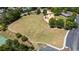 Aerial view of a large grassy recreation area, walking trails, and playground area at 4115 Gold Mill Rdg, Canton, GA 30114