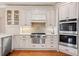 Well-equipped kitchen featuring stainless steel appliances and white cabinets at 4115 Gold Mill Rdg, Canton, GA 30114