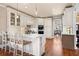 Bright kitchen with hardwood floors, marble countertops, and barstool seating at 4115 Gold Mill Rdg, Canton, GA 30114