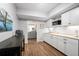 Bright kitchenette features white cabinets, modern appliances, and a gray accent wall at 4115 Gold Mill Rdg, Canton, GA 30114