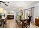 Elegant dining area features neutral walls, a piano, and a view of trees at 4115 Gold Mill Rdg, Canton, GA 30114