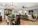 Open-concept space features elegant dining and living areas with hardwood floors at 4115 Gold Mill Rdg, Canton, GA 30114