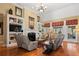 Spacious living room with fireplace, built-ins, hardwood floors, and natural light at 4115 Gold Mill Rdg, Canton, GA 30114