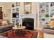 Cozy living room showcases a fireplace with built-ins and a decorative rug at 4115 Gold Mill Rdg, Canton, GA 30114