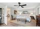 Bright main bedroom features a king bed, a ceiling fan, and neutral paint at 4115 Gold Mill Rdg, Canton, GA 30114