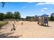 Image of a large sand-filled playground area with slides, swings, and climbing structures at 4115 Gold Mill Rdg, Canton, GA 30114