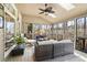 Inviting screened-in porch with cozy seating, ceiling fan, and wooded views at 4115 Gold Mill Rdg, Canton, GA 30114
