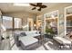 Relaxing screened porch with comfortable seating, ceiling fan, and outdoor views at 4115 Gold Mill Rdg, Canton, GA 30114