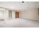 Spacious carpeted basement featuring built-in shelving, closet, and recessed lighting at 4429 Windsor Oaks Cir, Marietta, GA 30066