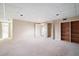 Finished basement space with carpet, built-in shelving, and closet, perfect for entertaining at 4429 Windsor Oaks Cir, Marietta, GA 30066