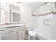 Well-lit bathroom features a shower-tub combo and stylish vanity with granite countertop at 4429 Windsor Oaks Cir, Marietta, GA 30066