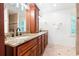Bathroom with granite countertop, double sinks, tiled floors, and window at 4429 Windsor Oaks Cir, Marietta, GA 30066