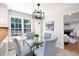 Cozy breakfast nook with modern lighting and a glass table next to an exit to the patio at 4429 Windsor Oaks Cir, Marietta, GA 30066