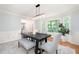 Stylish dining room features a dark wood table, bench seating, and natural light at 4429 Windsor Oaks Cir, Marietta, GA 30066