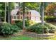 Charming two-story brick home featuring a manicured front yard and an attached two-car garage at 4429 Windsor Oaks Cir, Marietta, GA 30066