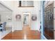 Bright foyer with gleaming hardwood floors and a view of the dining room and hall at 4429 Windsor Oaks Cir, Marietta, GA 30066