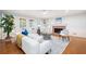 Bright living room with a fireplace, hardwood floors, and lots of natural light at 4429 Windsor Oaks Cir, Marietta, GA 30066
