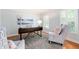 Light-filled office with stylish chairs, shutters, and a view to the yard at 4429 Windsor Oaks Cir, Marietta, GA 30066