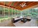 Screened-in porch with vaulted wood ceilings, comfortable seating, and views of the private backyard at 4429 Windsor Oaks Cir, Marietta, GA 30066