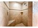 Tiled walk-in shower with built-in shelves and bench seating at 4429 Windsor Oaks Cir, Marietta, GA 30066