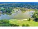 Golf course aerial featuring a picturesque lake and lush green landscaping at 3070 Ascot Ln, Roswell, GA 30076