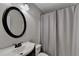 Well-lit bathroom with a large mirror and shower with curtain at 3070 Ascot Ln, Roswell, GA 30076