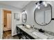 Bright bathroom featuring double sinks with granite counters and tile floors at 3070 Ascot Ln, Roswell, GA 30076