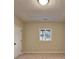 Neutral-toned bedroom featuring a window providing natural light at 3070 Ascot Ln, Roswell, GA 30076