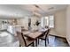 Elegant dining room with a stylish table setting, contemporary lighting, and an open-concept design at 3070 Ascot Ln, Roswell, GA 30076