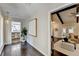 Welcoming entryway with hardwood floors, stylish lighting, and views of the open-concept living spaces at 3070 Ascot Ln, Roswell, GA 30076