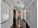 Inviting foyer with hardwood floors, modern lighting fixture, and direct access to multiple rooms at 3070 Ascot Ln, Roswell, GA 30076
