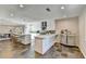 Modern kitchen with white cabinetry, stainless steel appliances, large countertops, and an island with seating at 3070 Ascot Ln, Roswell, GA 30076
