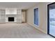 Spacious living room features built-in shelving and a stone fireplace, perfect for entertaining at 3070 Ascot Ln, Roswell, GA 30076