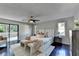 Bright main bedroom featuring a ceiling fan, sitting area, and access to a balcony at 3070 Ascot Ln, Roswell, GA 30076