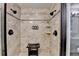 Bright bathroom featuring a shower with seating and dual shower heads at 3070 Ascot Ln, Roswell, GA 30076