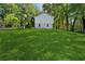Expansive green lawn extends from the home's rear, creating a serene and spacious outdoor retreat at 4745 Elam Forest Dr, Stone Mountain, GA 30083
