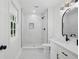 Bathroom featuring a vanity, shower, modern lighting, and a window with a view of the outdoors at 4745 Elam Forest Dr, Stone Mountain, GA 30083