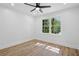 Bright bedroom features a ceiling fan and a window that offers a lush green view at 4745 Elam Forest Dr, Stone Mountain, GA 30083