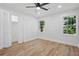 Well-lit bedroom with closet and windows overlooking a green landscape at 4745 Elam Forest Dr, Stone Mountain, GA 30083